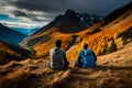 A group of backpackers resting on a mountaintop, surrounded by vibrant autumn foliage and distant peaks