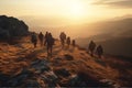 A group of backpackers walking through the mountains at sunset. Royalty Free Stock Photo