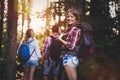 Group of backpacking hikers going for forest trekking