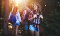 Group of backpacking hikers going for forest trekking