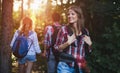 Group of backpacking hikers going for forest trekking