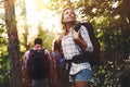 Group of backpacking hikers going for forest trekking