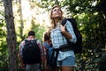 Group of backpacking hikers going for forest trekking Royalty Free Stock Photo