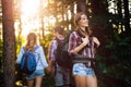 Group of backpacking hikers going for forest trekking Royalty Free Stock Photo