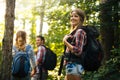 Group of backpacking hikers going for forest trekking Royalty Free Stock Photo