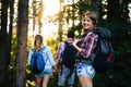 Group of backpacking hikers going for forest trekking Royalty Free Stock Photo