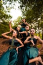 A Group of Balinese people wearing traditional green costume before the dance festival begin