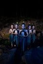 A Group of Balinese woman line up with the wooden mask in their hands while wearing a traditional dance costumes Royalty Free Stock Photo