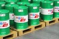 Group of barrels with motor oil lubricant on shipping pallets in