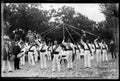 Group of Basque dancers with ribbons in a circle.