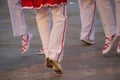 Group of Basque folk dancers performing in a vibrant outdoor festival