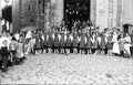 Group of Basque girls dancing in front of a church