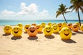 A group of beach balls with smiling faces are arranged on the sand Royalty Free Stock Photo