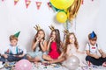 Group of kids having fun and looking happy on birthday party Royalty Free Stock Photo