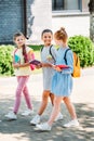 group of beautiful schoolgirls walking together