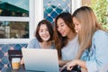 Group of beautiful smart business freelance Asian women in smart casual wear working together on laptop or computer.