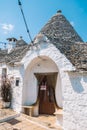 Group of beautiful Trulli, traditional Apulian dry stone wall hut old houses with a conical roof in Alberobello Royalty Free Stock Photo