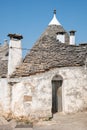 Group of beautiful Trulli, traditional Apulian dry stone wall hut old houses with a conical roof in Alberobello Royalty Free Stock Photo