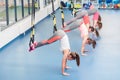 Group of beautiful young women working out on TRX Royalty Free Stock Photo