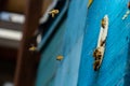 Group of bees near a beehive, in flight. Wooden beehive and bees. Bees fly out and fly into the round entrance of a wooden vintage