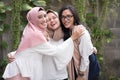 Group of best fiend muslim girl smiling at camera while hugging