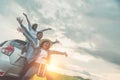 Group of best friends cheering on car road trip at sunset - Happy people outdoor on vacation tour adventure - Friendship concept Royalty Free Stock Photo