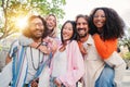 Group of best friends having fun, laughing and smiling taking a selfie portrait outside. Young adult international Royalty Free Stock Photo