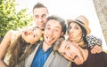 Group of best friends taking selfie outdoor with back lighting Royalty Free Stock Photo