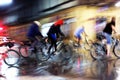 Group of bicycle riders at rainy night