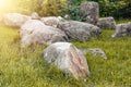 Group of big rocks or stones on green grass. Boulders or bowlders Royalty Free Stock Photo