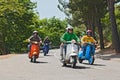 Group of bikers riding a vintage italian scooters Royalty Free Stock Photo