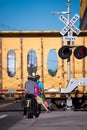 Group of bikers are waiting for the train to pass and the barrie