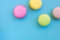 Group of biscuits known as macarons or macaroons on blue backgrouns Royalty Free Stock Photo