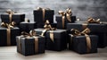 A group of black boxes with gold ribbons Royalty Free Stock Photo