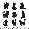 Group of black cat silhouettes sitting, walking, standing isolated on white background. Royalty Free Stock Photo