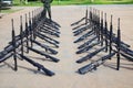 The group of black rifles lay on the cement floor to organize military combat concepts.