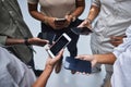 Group, blank phone screen and people with mockup on mobile, social network app and website from above. Closeup, hands