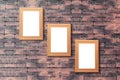 Group of blank wood picture frame on the old brick wall with cop Royalty Free Stock Photo