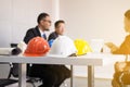 Group of blurred architect asian people meeting and working communicating while sitting at room office desk together,Teamwork Conc