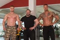 Group Of Bodybuilders Posing in Gym Royalty Free Stock Photo