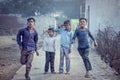 Group of boisterous Indian children running for photograph in Agra, Uttar Pradesh, India