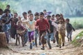 Group of boisterous Indian children running for photograph in Agra, Uttar Pradesh, India Royalty Free Stock Photo