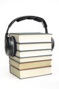 Group of books and headphones related to audio books on isolated Royalty Free Stock Photo