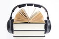 Group of books and headphones related to audiobooks on isolated Royalty Free Stock Photo