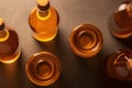 A group of bottles of liquid sitting on top of a table. AI generative image