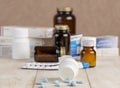 A group of boxes of medicines, pill bottles, thermometer and blisters of pills Royalty Free Stock Photo