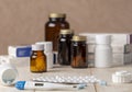 A group of boxes of medicines, pill bottles, thermometer and blisters of pills