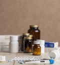 A group of boxes of medicines, pill bottles, thermometer and blisters of pills Royalty Free Stock Photo