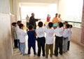 Group of boys in circles getting instructions from teacher Royalty Free Stock Photo