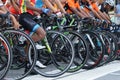 A group of boys dressed in cycling sports along with their bikes